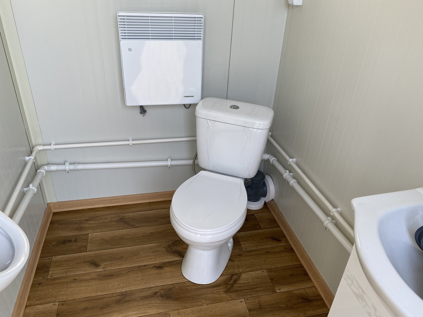 Contenedor sanitario doble con depósito de residuos.